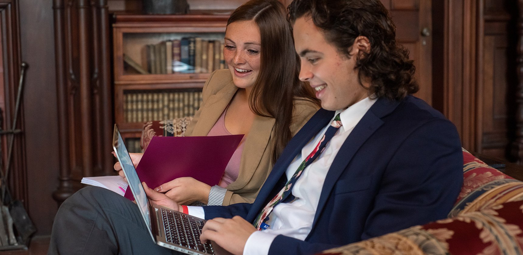 Two Hoosac students looking at a laptop together